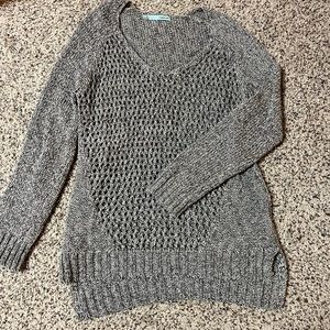 Lightweight sweater, knit, yet see-through.